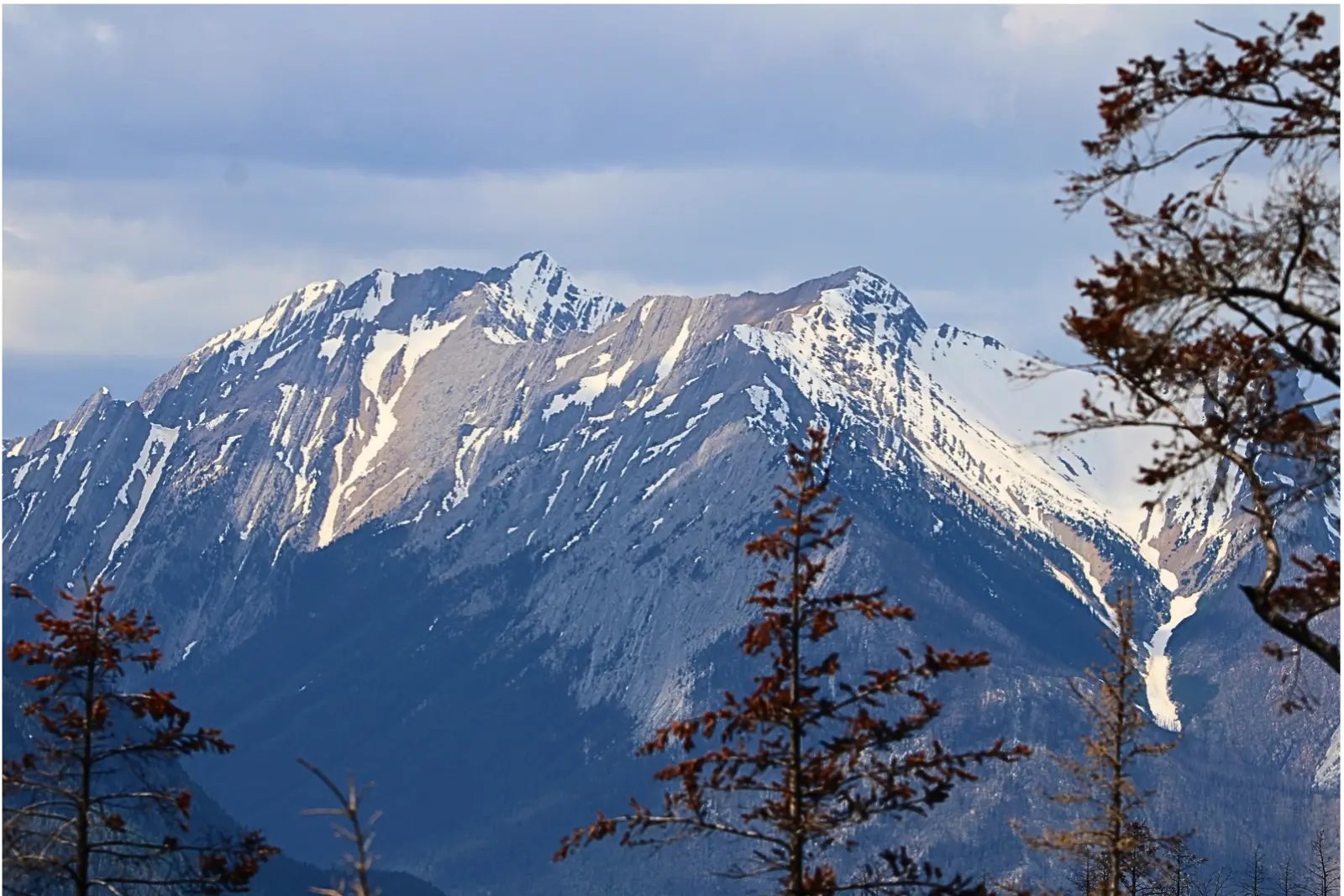 Snow-patched peaks above the town of Jasper.