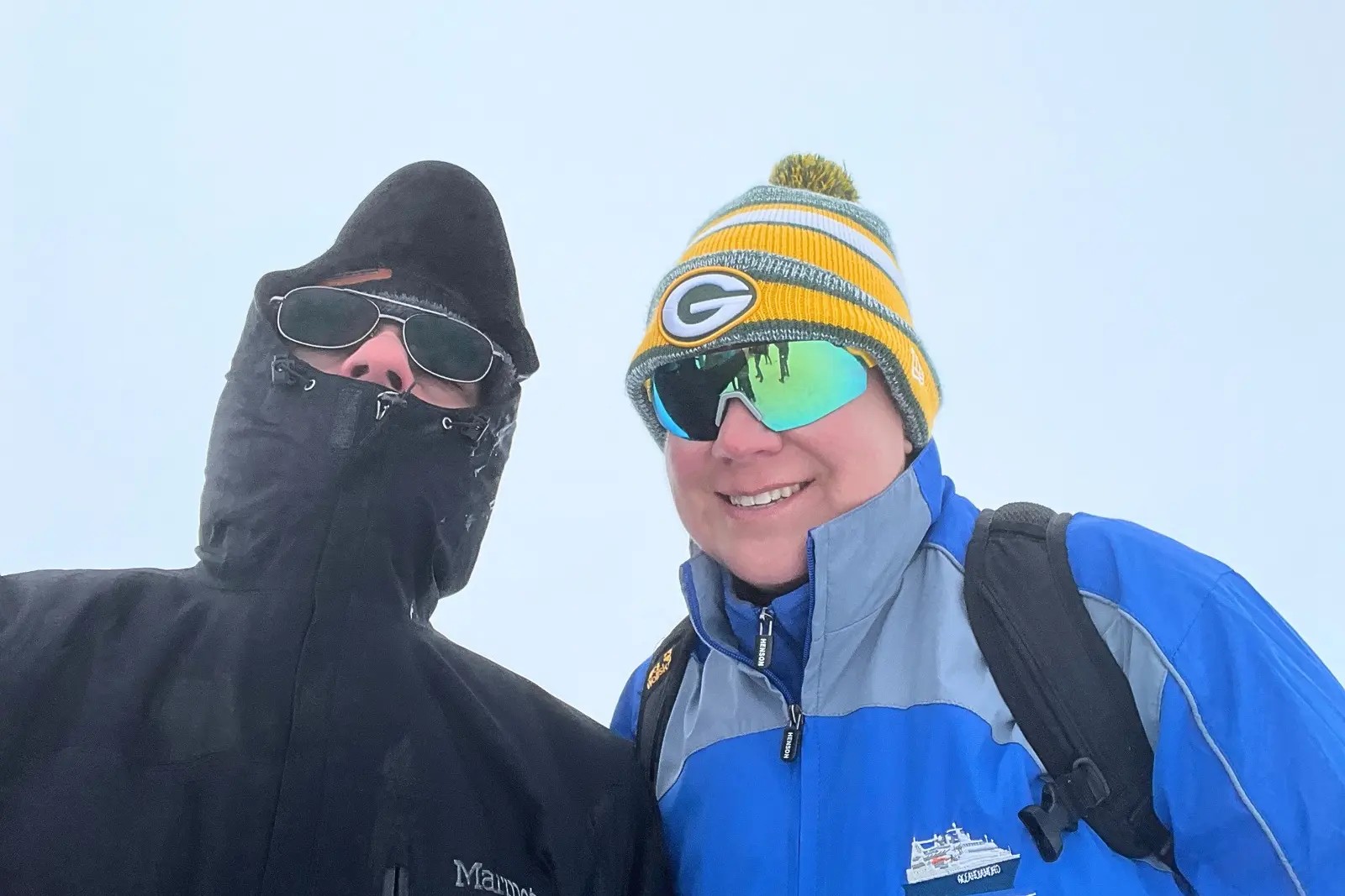 Chris and Erika Commisso bundled up in a whiteout on Snæfellsjökull, Erika in an Ocean Diamond jacket.