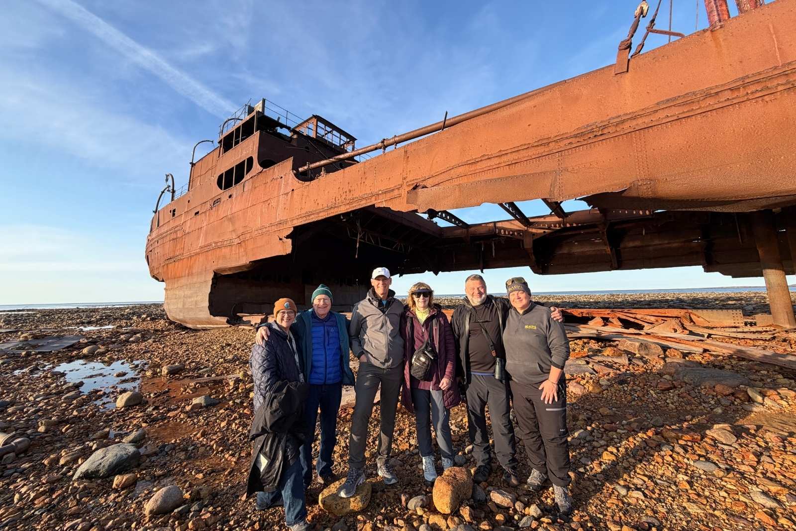 Chris Commisso at the wreck of the Ithaca on the tidal flats at low tide.